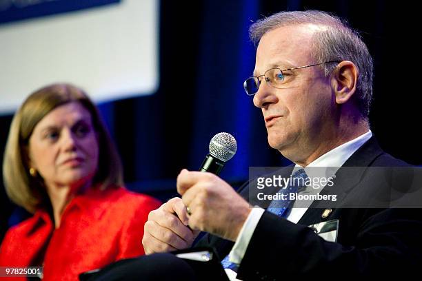 Thomas Hoenig, president of the Federal Reserve Bank of Kansas City, right, speaks during a panel discussion with Cleveland Federal Reserve Bank...