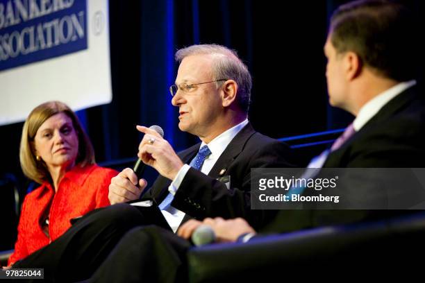 Thomas Hoenig, president of the Federal Reserve Bank of Kansas City, center, speaks during a panel discussion with Cleveland Federal Reserve Bank...