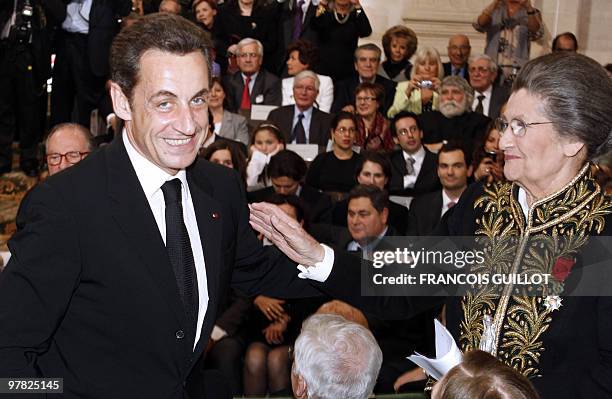 French Simone Veil , an Auschwitz survivor and the first elected president of the European parliament, is congratulated by French President Nicolas...