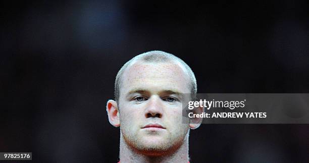 Manchester United's English forward Wayne Rooney lines up before their UEFA Champions League Group E football match against Celtic at Old Trafford in...