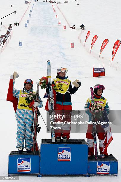 Eliza Outtrim of the USA takes 1st place, Margarita Marbler of Austria takes 2nd place, Heather McPhie of the USA takes 3rd place during the FIS...