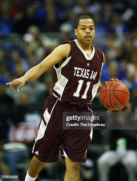 Holmes of the Texas A&M Aggies brings the ball up the court against the Kansas Jayhawks during the semifinals of the 2010 Phillips 66 Big 12 Men's...