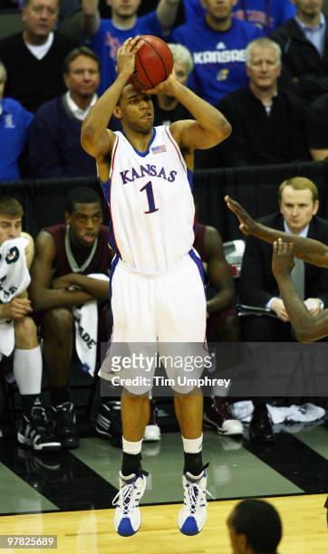 Xavier Henry of the Kansas Jayhawks shoots a three pointer against the Texas A&M Aggies during the semifinals of the 2010 Phillips 66 Big 12 Men's...