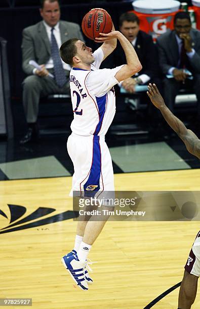 Brady Morningstar of the Kansas Jayhawks shoots a three pointer against the Texas A&M Aggies during the semifinals of the 2010 Phillips 66 Big 12...