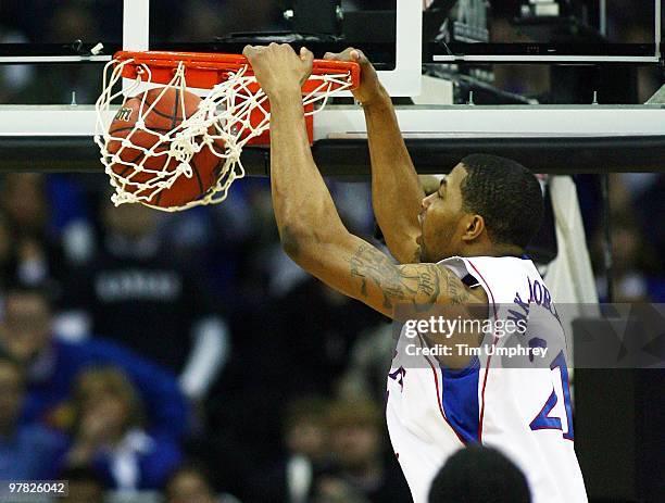 Markieff Morris of the Kansas Jayhawks dunks the ball against the Texas A&M Aggies during the semifinals of the 2010 Phillips 66 Big 12 Men's...