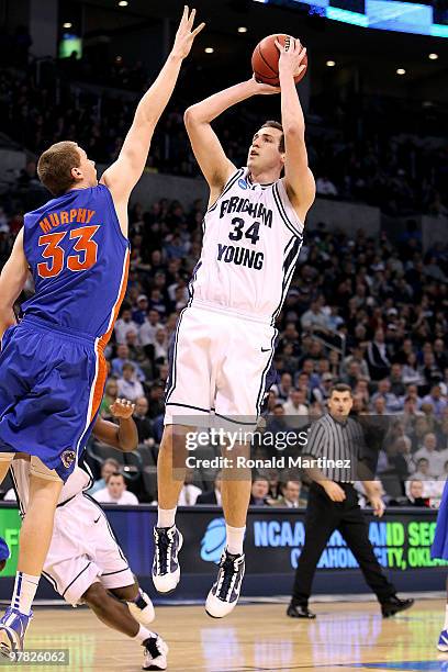 Noah Hartsock of the BYU Cougars attempts a shot against Erik Murphy of the Florida Gators during the first round of the 2010 NCAA men�s basketball...