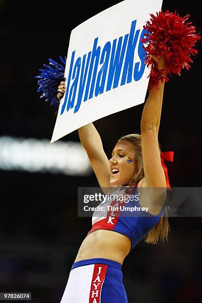 University of Kansas cheerleader performs during the semifinals of the 2010 Phillips 66 Big 12 Men's Basketball Tournament against the Texas A&M...