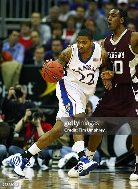 Marcus Morris of the Kansas Jayhawks tries to muscle his way to the basket against the Texas A&M Aggies during the semifinals of the 2010 Phillips 66...