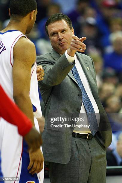 Head coach Bill Self of the Kansas Jayhawks coaches Xavier Henry from the sideline during the semifinals of the 2010 Phillips 66 Big 12 Men's...