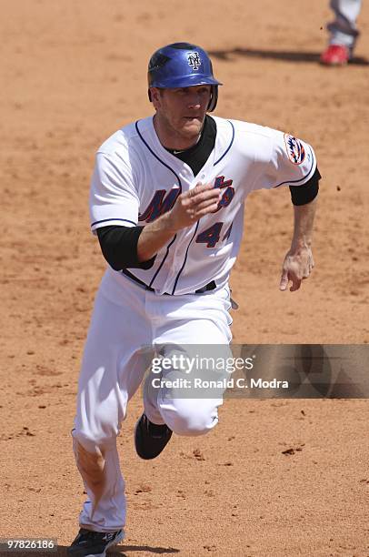 Jason Bay of the New York Mets runs to third base during a game against the St. Louis Cardinals at Tradition Field on March 15, 2010 in Port St....