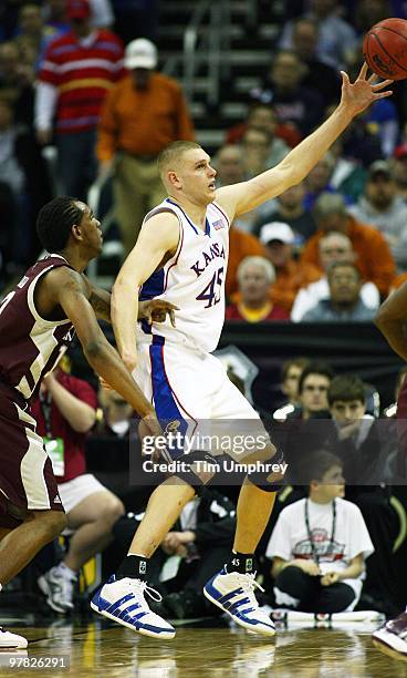 Cole Aldrich of the Kansas Jayhawks receives a pass in the post against the Texas A&M Aggies during the semifinals of the 2010 Phillips 66 Big 12...