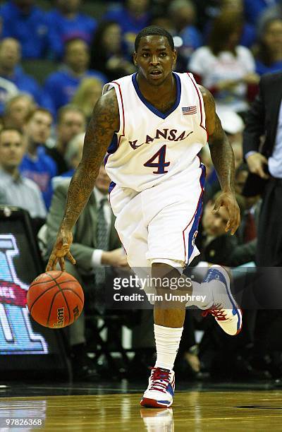 Sherron Collins of the Kansas Jayhawks brings the ball up the court against the Texas A&M Aggies during the 2010 Phillips 66 Big 12 Men's Basketball...