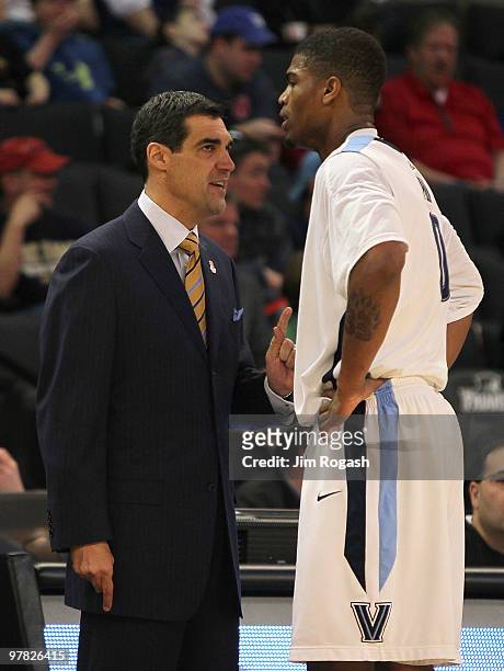 Coach Jay Wright speaks to Antonio Pena of the Villanova Wildcats against the Robert Morris Colonials during the first round of the NCAA men's...