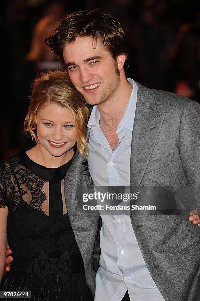 Emllie de Ravin and Robert Pattison attends the UK Premiere of 'Remember Me' at Odeon Leicester Square on March 17, 2010 in London, England.