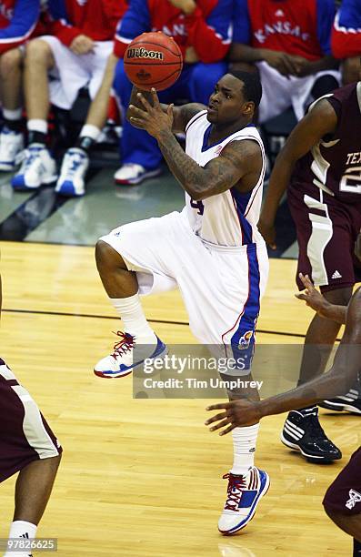 Sherron Collins of the Kansas Jayhawks shoots a running jump shot against the Texas A&M Aggies during the 2010 Phillips 66 Big 12 Men's Basketball...