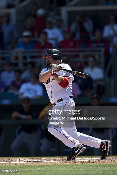 Kevin Youkilis of the Boston Red Sox bats during a game against the Pittsburgh Pirates at at City of Palms Park on March 13, 2010 in Fort Myers,...