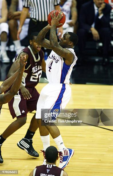 Sherron Collins of the Kansas Jayhawks shoots a jump shot against the Texas A&M Aggies during the 2010 Phillips 66 Big 12 Men's Basketball Tournament...