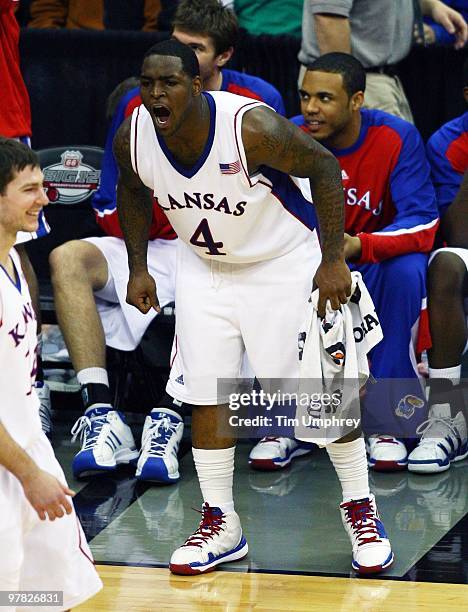 Sherron Collins of the Kansas Jayhawks cheers on his teammates from the sidelines during the semifinals of the 2010 Phillips 66 Big 12 Men's...