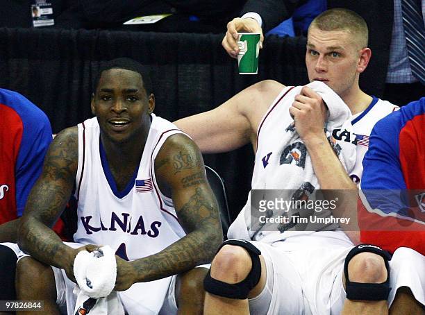 Sherron Collins and Cole Aldrich of the Kansas Jayhawks watch the action from the bench during the 2010 Phillips 66 Big 12 Men's Basketball...