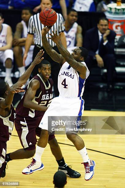 Sherron Collins of the Kansas Jayhawks shoots a jump shot against the Texas A&M Aggies during the 2010 Phillips 66 Big 12 Men's Basketball Tournament...