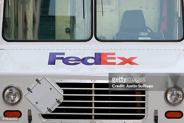 The FedEx logo is displayed on the front of a truck March 18, 2010 in San Francisco, California. FedEx third quarter earnings doubled with reported...