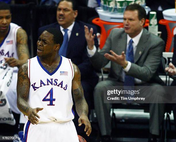 Sherron Collins and head coach Bill Self of the Kansas Jayhawks dispute a call during the semifinals of the 2010 Phillips 66 Big 12 Men's Basketball...