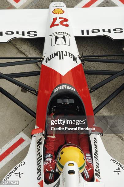 Ayrton Senna sits in the cockpit of the Marlboro McLaren-Honda MP4/6 during the Spanish Grand Prix on 29th September 1990at the Circuit Jerez de la...