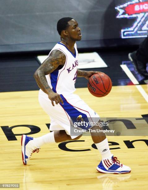 Sherron Collins of the Kansas Jayhawks brings the ball up the court against the Texas A&M Aggies during the 2010 Phillips 66 Big 12 Men's Basketball...