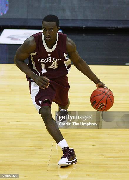 Andrew Darko of the Texas A&M Aggies dribbles around the perimeter against the Kansas Jayhawks during the semifinals of the 2010 Phillips 66 Big 12...