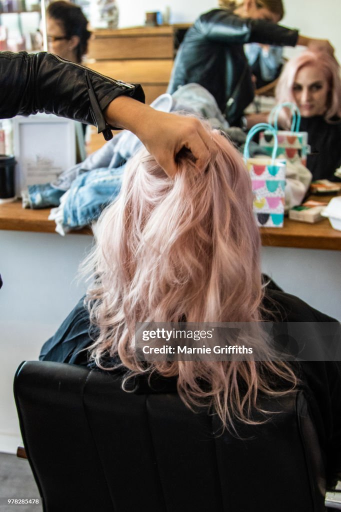 Young woman having her hair done