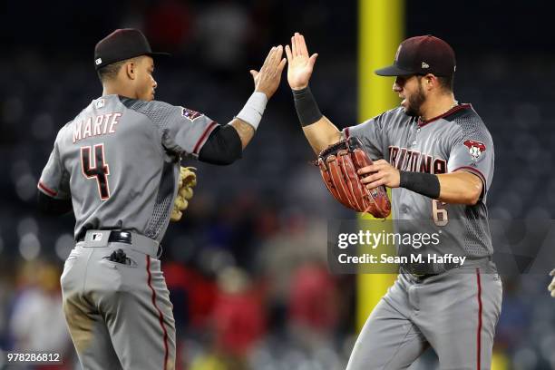 Ketel Marte of the Arizona Diamondbacks congratulates David Peralta of the Arizona Diamondbacks after defeating the Los Angeles Angels of Anaheim 7-4...