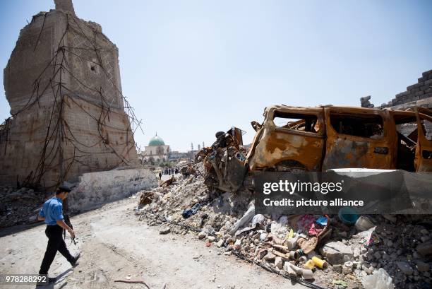 Policeman secures a location next to a mosque that was destroyed by the so-called Islamic State terror organization, in Mosul, Iraq, 24 April 2018....