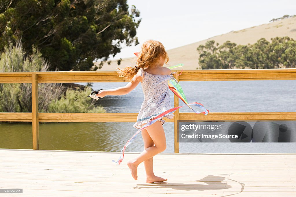Girl playing on jetty