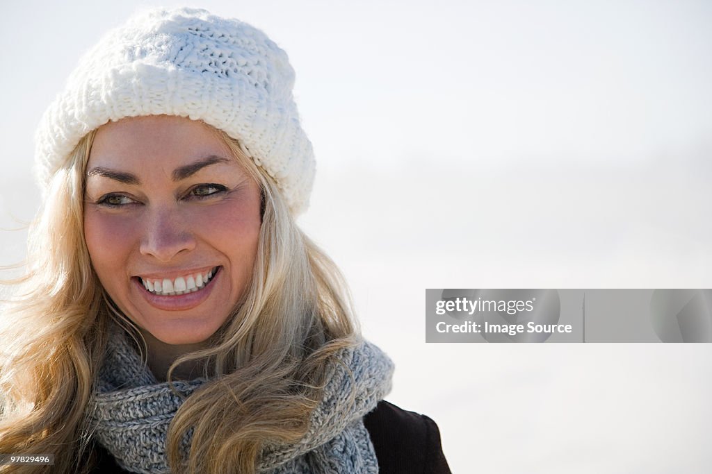 Woman wearing a knit hat and scarf