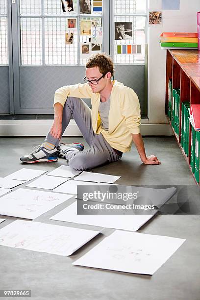 fashion designer at work - sitting on ground stock pictures, royalty-free photos & images