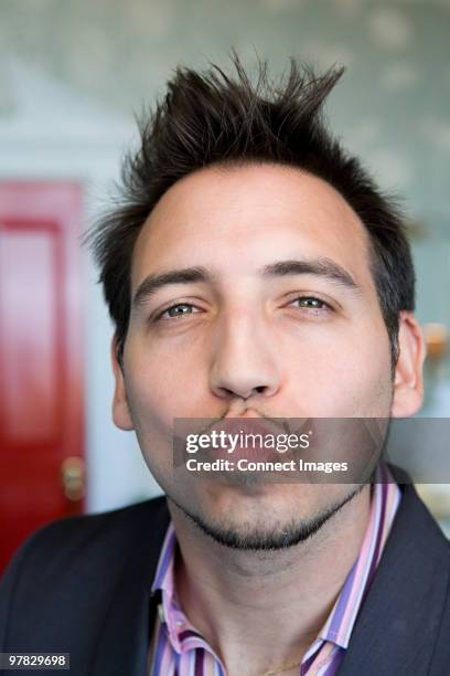 man blowing a kiss - hacer pucheros fotografías e imágenes de stock