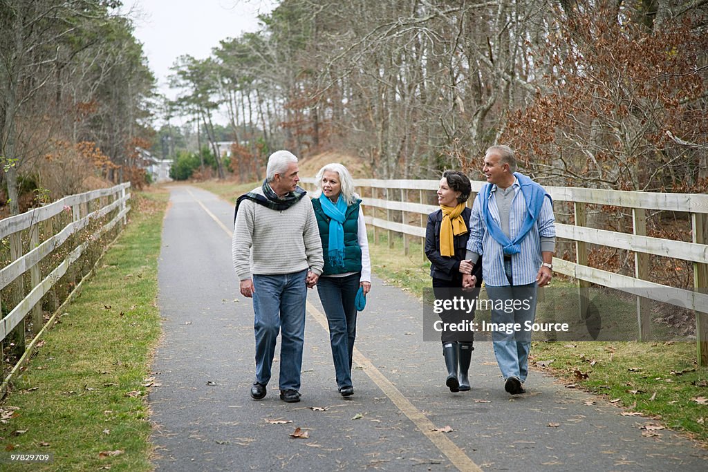 Friends walking along path