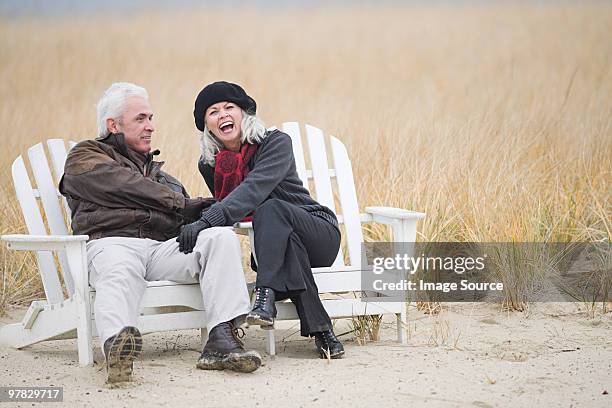 mature couple laughing - massachusetts beach stock pictures, royalty-free photos & images