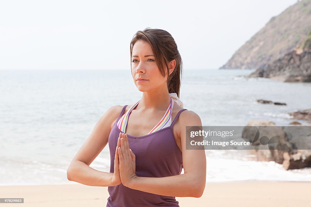 Woman in prayer pose