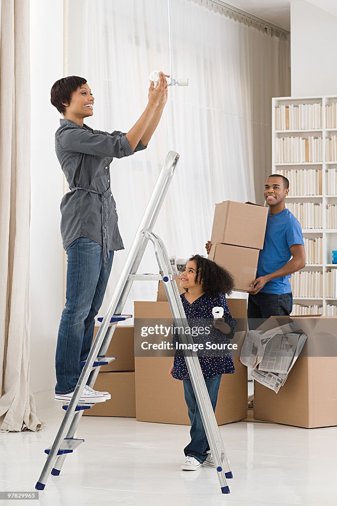 Woman fitting lightbulb