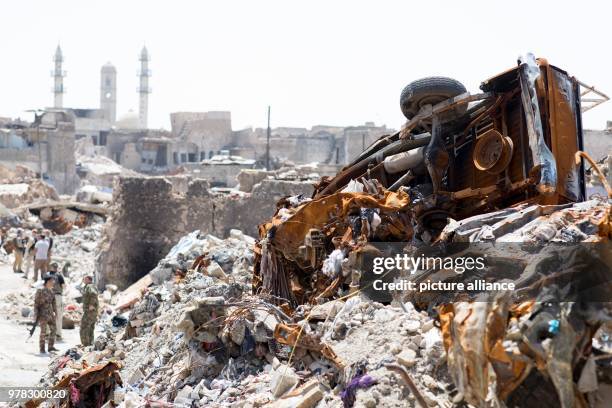 April 2018, Iraq, Mosul: Soldiers secure a location next to a mosque destroyed by the Islamic State. German Development Minister Gerd Mueller of the...