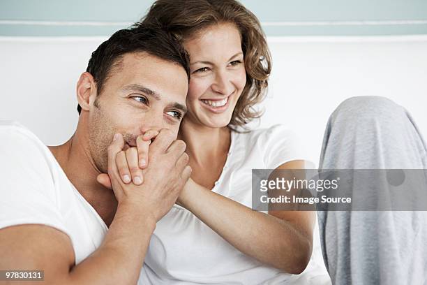 loving couple - man and woman kissing in bed stock pictures, royalty-free photos & images