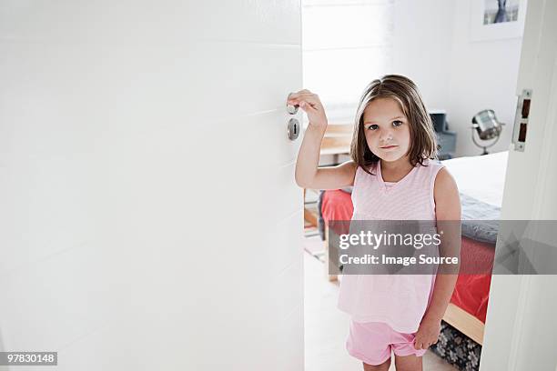 girl at door of room - bedroom doorway stock pictures, royalty-free photos & images