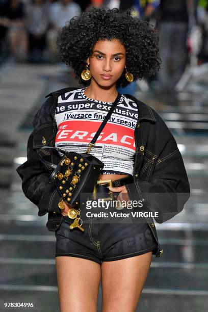 Imaan Hammam walks the runway at the Versace Fashion show during Milan Men's Fashion Week Spring/Summer 2019 on June 16, 2018 in Milan, Italy.