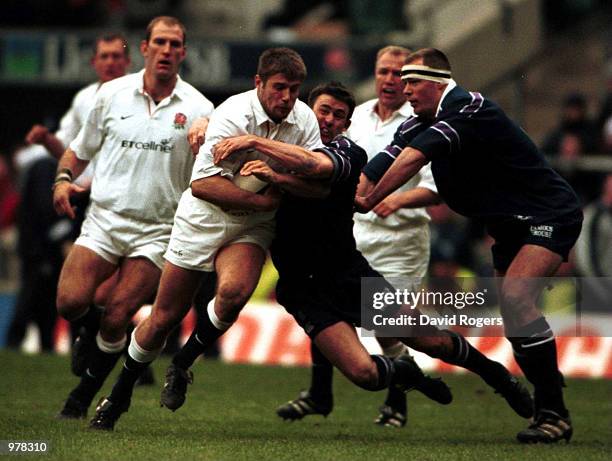 Ben Cohen of England breaks through the tackle of John Lesile of Scotland during the match between England and Scotland in the Six Nations...