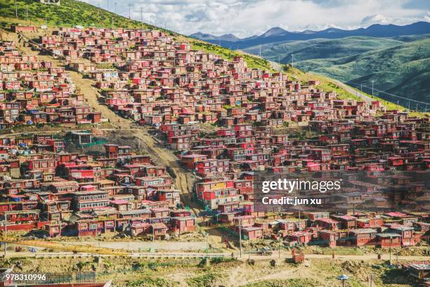 outside the building of china's sida wuming buddhist academy in sichuan province - sida stock pictures, royalty-free photos & images