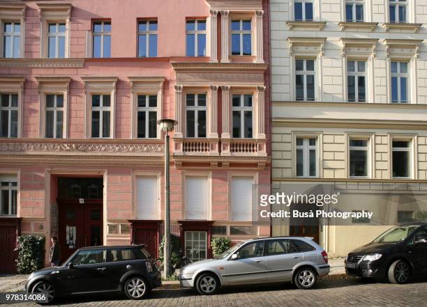 facades of beautifully renovated old residential buildings in berlin (germany), district of prenzlauer berg - berlino stock-fotos und bilder