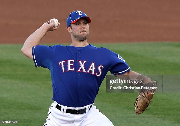 Starting pitcher Rich Harden of the Texas Rangers pitches against the San Francisco Giants during the MLB spring training game at Surprise Stadium on...