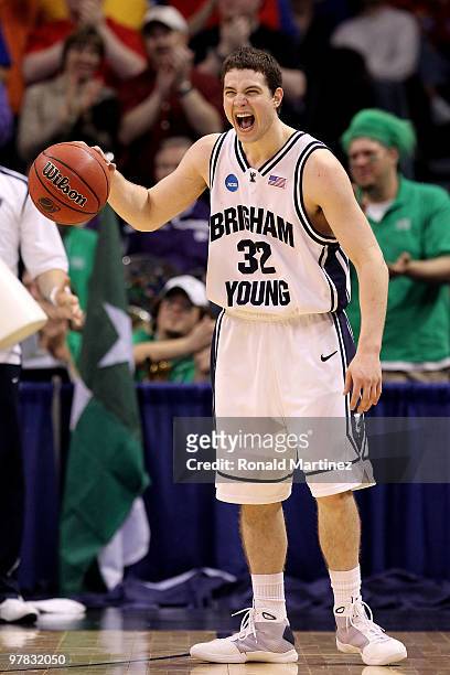 Jimmer Fredette of the BYU Cougars celebrates after BYU won in 99-92 double in overtime against the Florida Gators during the first round of the 2010...