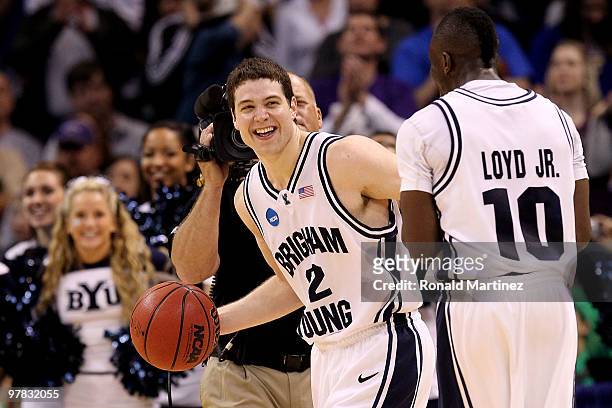 Jimmer Fredette and Michael Loyd Jr. #10 of the BYU Cougars celebrate after BYU won in 99-92 double in overtime against the Florida Gators during the...
